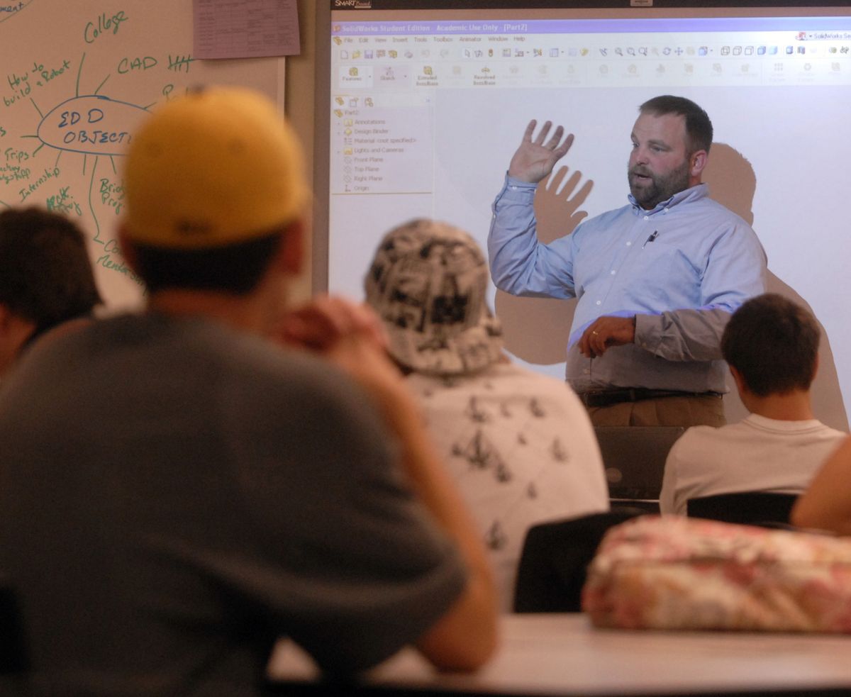 Teacher Eric Groshoff explains the puzzle cube challenge to his students during a computer-aided design class at West Valley High School.  (J. BART RAYNIAK / The Spokesman-Review)