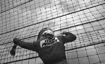 
Helio Castroneves has been known to climb a fence or two after a victory. 
 (Associated Press / The Spokesman-Review)