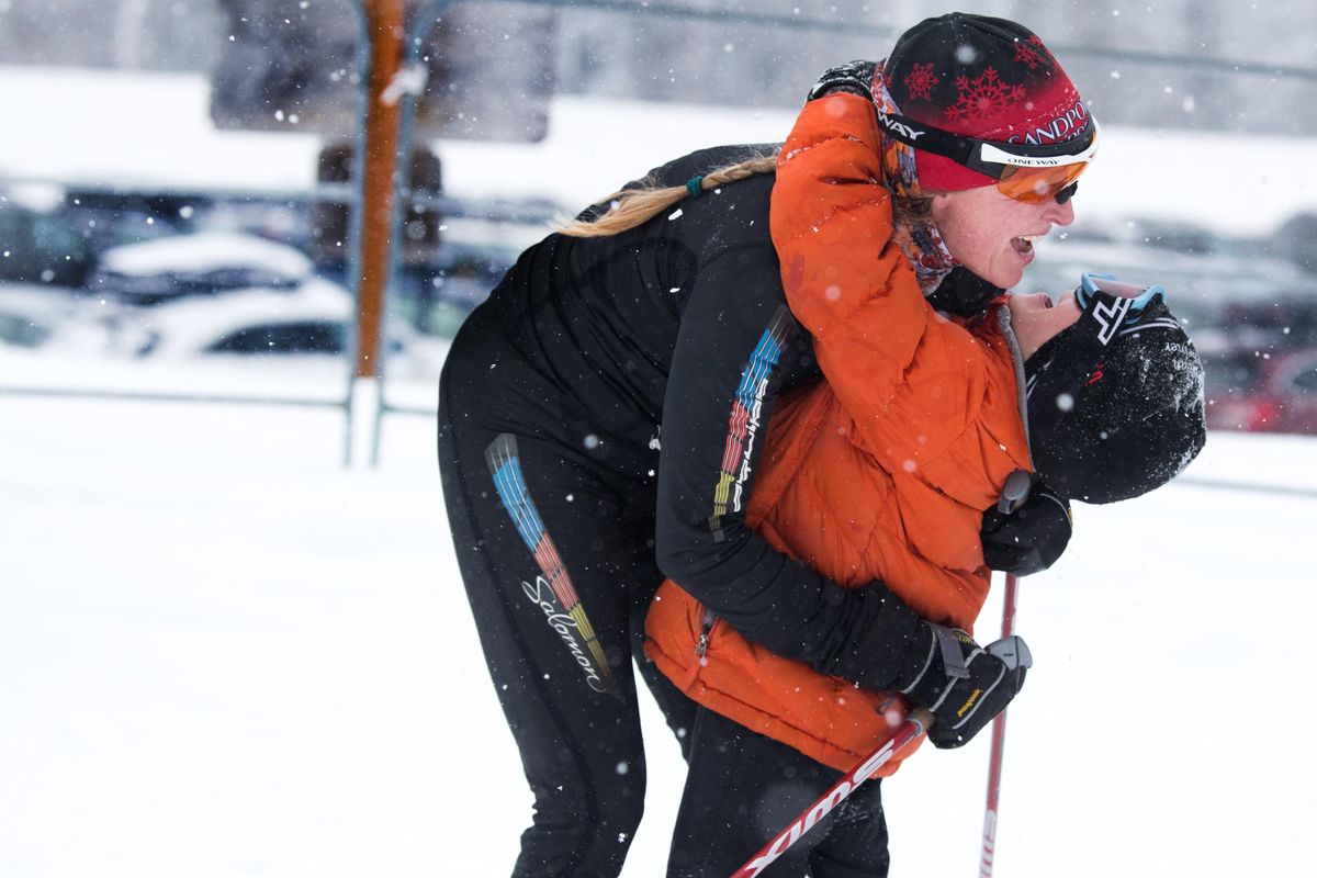 2006 Olympian Rebecca Dussault embraces her son Anselm after she won the 2018 Langlauf 10K Cross Country Ski Race on Sunday, Feb. 18, 2018, at Mount Spokane State Park. (Tyler Tjomsland / The Spokesman-Review)