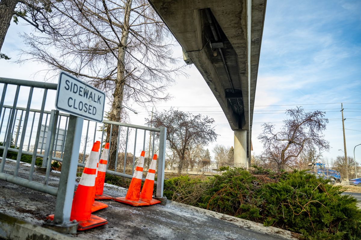 After an inspection determined the Magnolia Steet pedestrian bridge spanning I-90 was rated beyond repair by the Washington Department of Transportation, the structure near Liberty Park was permanently closed on Wednesday.  (COLIN MULVANY/THE SPOKESMAN-REVI)