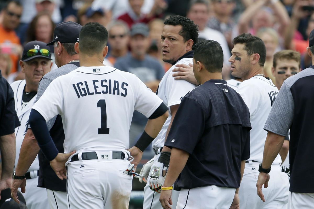 Detroit Tigers’ Miguel Cabrera looks back at the New York Yankees as he is guided off the field by teammate Ian Kinsler, right, and Jose Iglesias (1) following a bench-clearing fight during the sixth inning a of a baseball game Thursday, Aug. 24, 2017, in Detroit. (Duane Burleson / Associated Press)