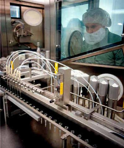 
Syringes are loaded with influenza vaccine at a Chiron facility in Liverpool, England, in an undated photo provided by Chiron Corp. Chiron Corp.'s strategy to dominate the U.S. flu vaccine market is in tatters and the company's financial future is clouded as the public health crisis it caused continues to mount. 
 (Associated Press / The Spokesman-Review)