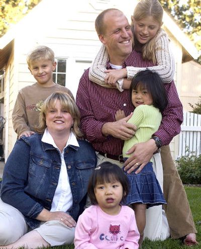 
Top left to right: Jacob, 7, Steve, Hannah, 11, bottom, Carrie, Abby, 1, and Lily, 3, make up the expanding Allen family. The Allens are adopting a 12-year-old Chinese girl and Steve is going to run the perimeter of the Spokane Valley City as a fund-raiser for their new daughter. 
 (Liz Kishimoto / The Spokesman-Review)