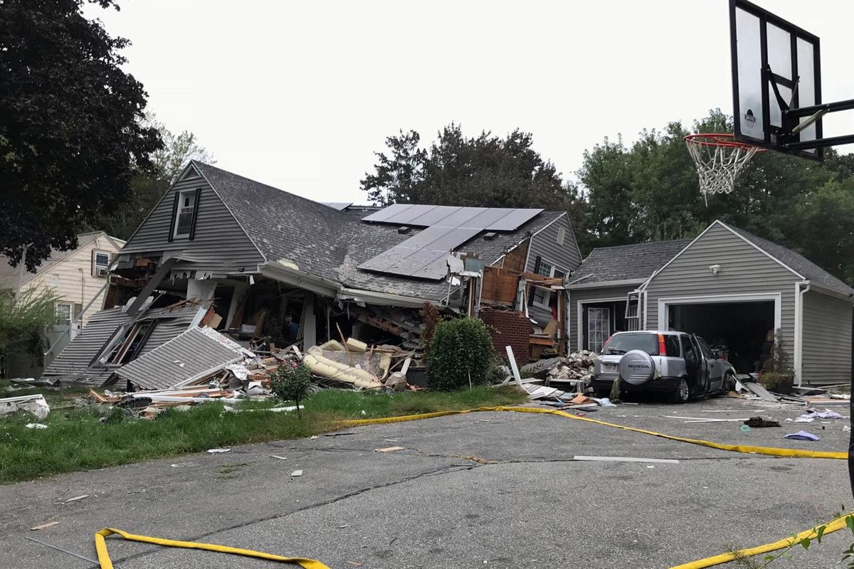A house is destroyed in Lawrence, Mass., Thursday, Sept. 13, 2018 after a series of gas explosions in the area. First-responders continued to fight at least 50 fires in Lawrence, Andover and North Andover Mass., Thursday. The fires are being attributed to problems with the natural gas system and officials are urging residents to leave their homes if they smell gas. (Carl Russo / Associated Press)