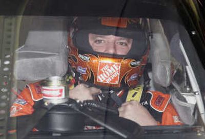 
Tony Stewart tightens his helmet before a practice session. Associated Press
 (Associated Press / The Spokesman-Review)