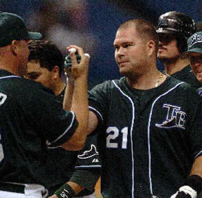 
Ty Wigginton (21) is congratulated after driving in the winning run for Tampa Bay.
 (Associated Press / The Spokesman-Review)