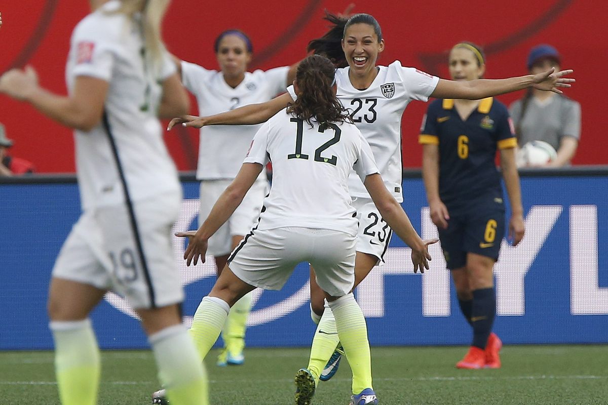 American Christen Press (23) celebrates her goal against Australia with Lauren Holiday (12) during Women’s World Cup match. (Associated Press)