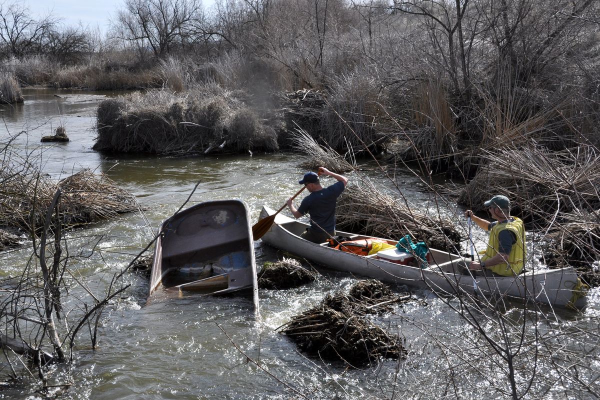 Myles Heistad, left, and Scott Wolff navigate a debris jam more deftly than a previous visitor.