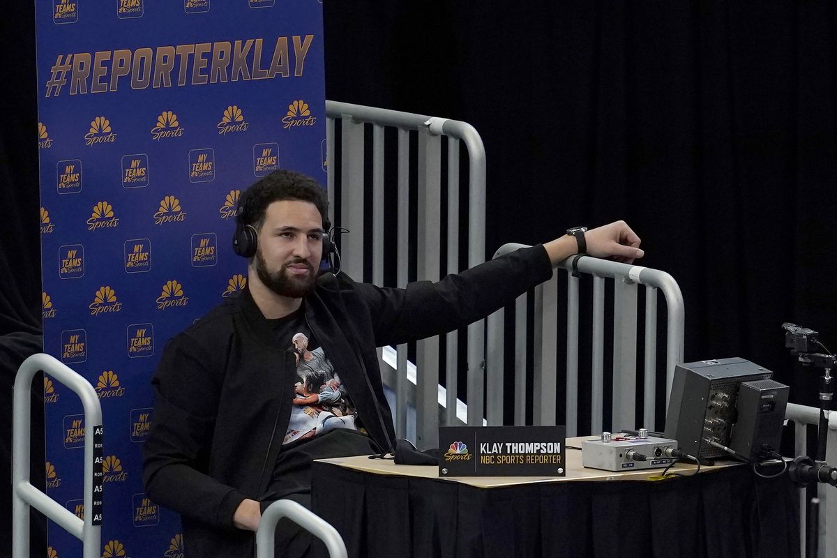 Injured Golden State Warriors guard Klay Thompson speaks as a guest analyst on a television broadcast during the second half of the team