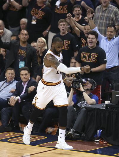 Cleveland Cavaliers forward LeBron James celebrates a basket against the Golden State Warriors during the second half of Game 6 of basketball's NBA Finals in Cleveland, Thursday, June 16, 2016. (Associated Press)
