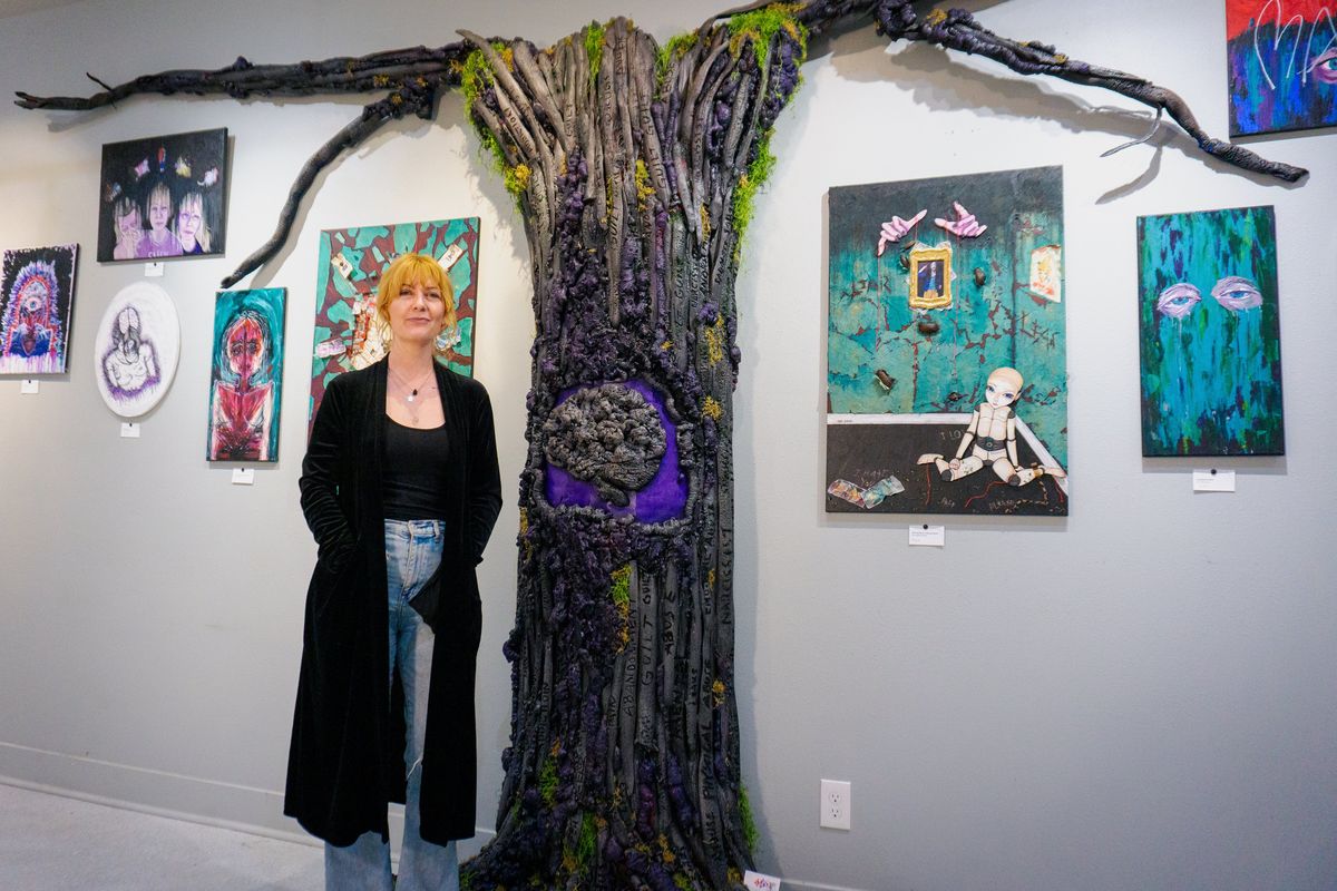 Tami Hennessy stands with her piece “Unraveling My Mind” at Shotgun Studios.  (Rachel Baker/For The Spokesman-Review)