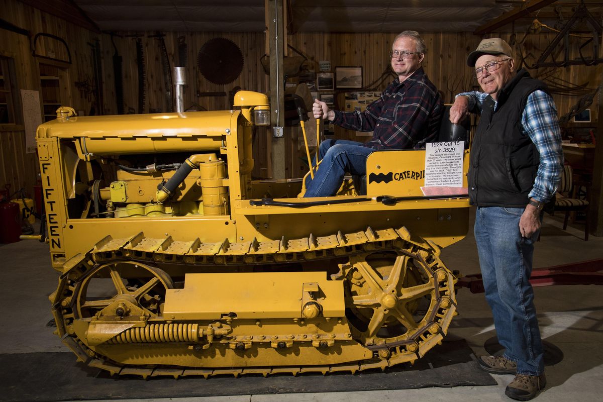 Eastern Washington Agricultural Museum board members Jay Franks, on right, and David Ruark show off a 1929 Caterpillar 15 tractor on display. The Agricultural Museum in Pomeroy, Wash, features a variety of farm implements and equipment and other historical antiques acquired and donated from framers in surrounding counties. (Colin Mulvany / The Spokesman-Review)