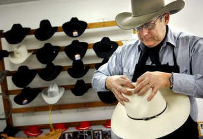 
Larry Shore shapes a straw hat in his shop near Norris, Mont., on Feb. 11. Shore and his wife, Terry, sell custom shaped hats and other tack from a trailer they haul to horse shows and fairs. Associated Press
 (Associated Press / The Spokesman-Review)