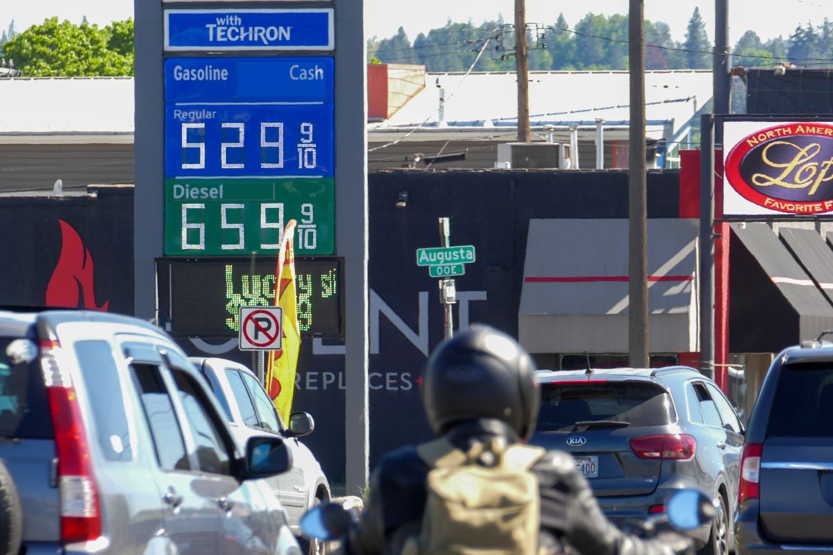 Drivers on Division Street pass a sign advertising gasoline for $5.29 per gallon on May 5 in Spokane.  (Jesse Tinsley/The Spokesman-Review)