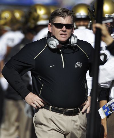 Colorado coach Dan Hawkins walks the sidelines during the first half of an NCAA college football game against Kansas in Lawrence, Kan. Kansas defeated Colorado 52-45. Hawkins has been fired, three days after the biggest meltdown in school history. (Orlin Wagner / Associated Press)