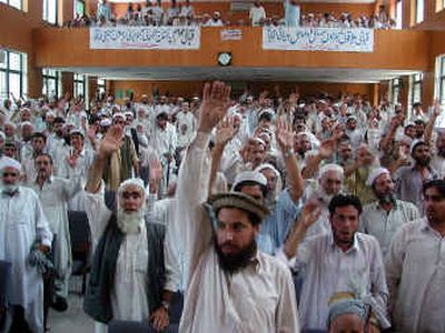 
People from Pakistani tribal areas chant slogans against U.S. and Pakistani military forces to protest the ongoing operations to nab al Qaeda suspects hiding in their areas along Afghanistan border, during a gathering Thursday in Peshawar, Pakistan.
 (Associated Press / The Spokesman-Review)