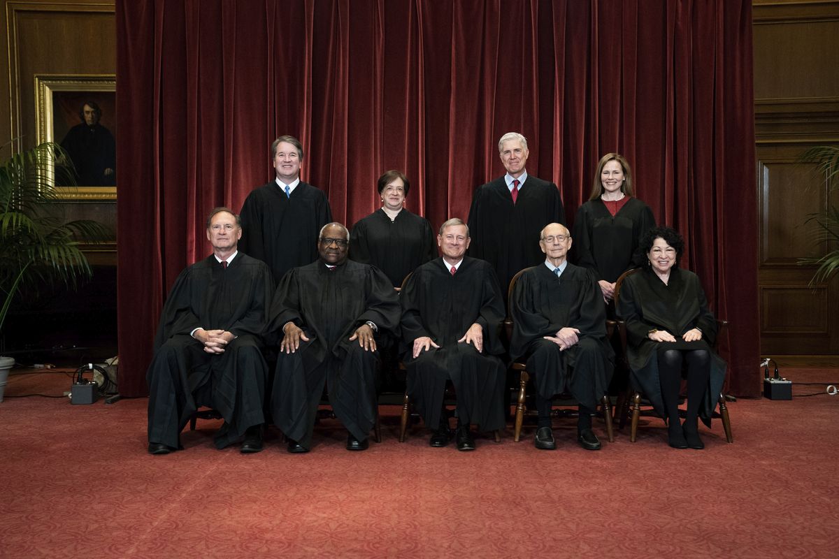 FILE - In this April 23, 2021, file photo members of the Supreme Court pose for a group photo at the Supreme Court in Washington. Seated from left are Associate Justice Samuel Alito, Associate Justice Clarence Thomas, Chief Justice John Roberts, Associate Justice Stephen Breyer and Associate Justice Sonia Sotomayor, Standing from left are Associate Justice Brett Kavanaugh, Associate Justice Elena Kagan, Associate Justice Neil Gorsuch and Associate Justice Amy Coney Barrett. Before the Supreme Court this is week is an argument over whether public schools can discipline students over something they say off-campus.  (Erin Schaff)