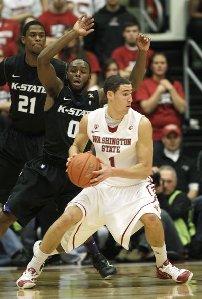 Washington State's Klay Thompson drives around Kansas State’s Jacob Pullen (0) and Jordan Henriquez-Roberts (21) in the first half. (Associated Press)