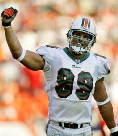 
Jason Taylor receives top defensive honor with 22 of 50 votes.
 (Associated Press / The Spokesman-Review)