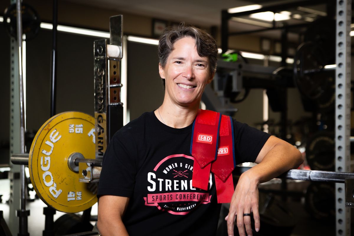 USA Women’s Powerlifting Hall of Famer Danna Snow pauses her workout for a portrait in the weightroom of A Perfect Fit Wellness Center in Spokane Valley on Aug. 13. Snow has done it all, from representing the U.S. in international weightlifting to refereeing national powerlifting competitions to owning her own business, The Body Clinic, on the South Hill.  (Libby Kamrowski/ THE SPOKESMAN-REVIEW)