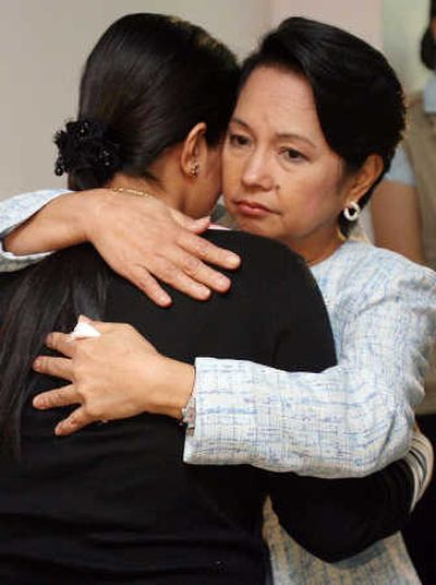 
Philippines President Gloria Macapagal Arroyo, right, consoles the widow of Rep. Wahab Akbar early  today. Associated Press
 (Associated Press / The Spokesman-Review)