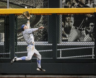 UCLA right fielder Eric Filia makes a leaping catch of a fly ball in the fifth inning Monday. (Associated Press)