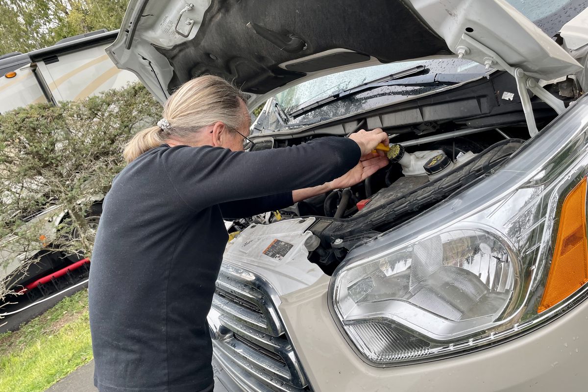 Checking under the hood during recent engine troubles. (Leslie Kelly)