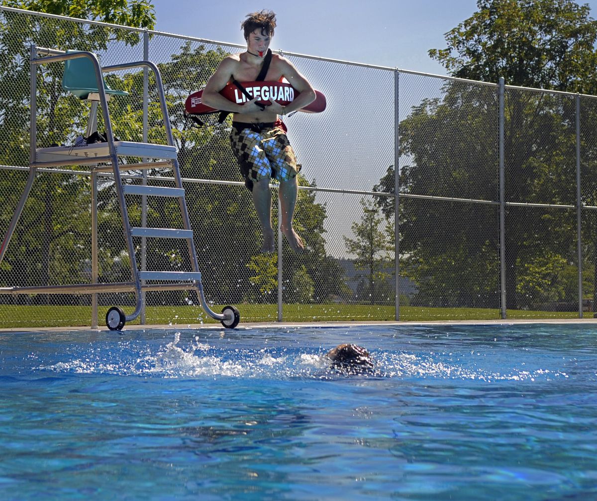 With Holly Tormey playing a  drowning victim for lifeguard-in-training Boone Schreibman on Wednesday at the Shadle Pool. (CHRISTOPHER ANDERSON / The Spokesman-Review)