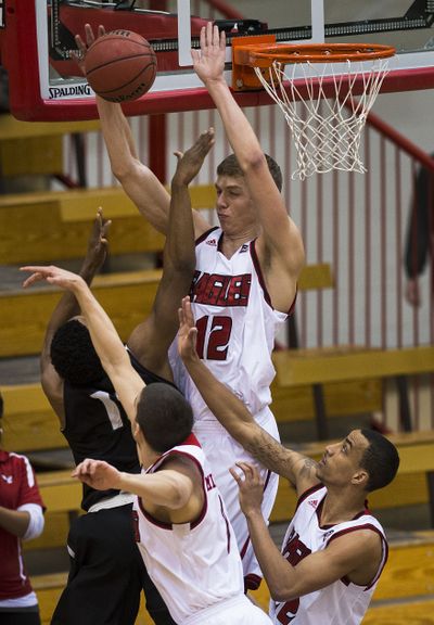 Eastern Washington’s Martin Seiferth (12) blocks a shot by Portland State’s Marcus Hall during the first half Monday at Reese Court. Seiferth finished with 13 points and seven rebounds in 21 minutes. (Colin Mulvany)