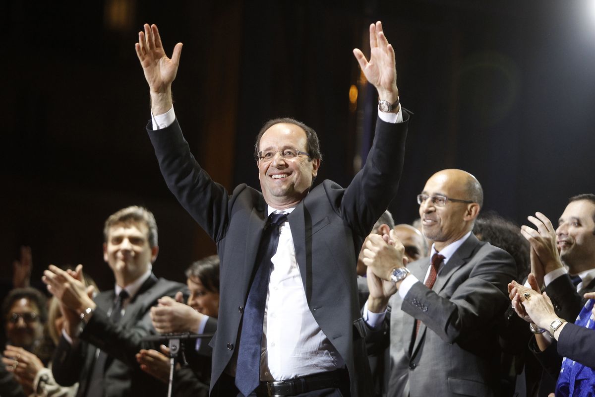 French President-elect Francois Hollande waves to the crowd gathered to celebrate his election victory in Bastille Square in Paris on Sunday. (Associated Press)