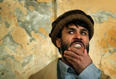 
Afghan Reza Khan reacts as the court delivers its verdict Saturday at a National Security Court in Kabul. 
 (Associated PressAssociated Press / The Spokesman-Review)