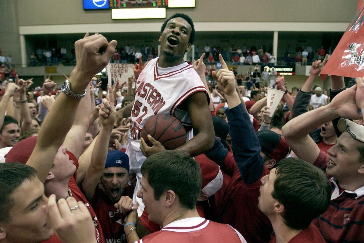 Eastern Washington’s Alvin Snow rides the shoulders of Eagles fans after winning a spot in the NCAA Tournament by beating Northern Arizona in March 2004. (Dan Pelle / The Spokesman-Review)