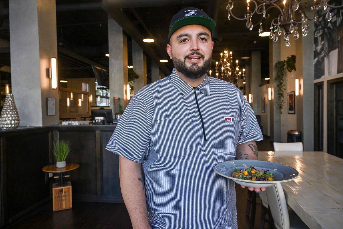 Manuel Montijo, co-owner of Doña-Magnolia, the restaurant in the lobby of Hotel Indigo in downtown Spokane, holds a plate of his ceviche.  (Jesse Tinsley/THE SPOKESMAN-REVIEW)