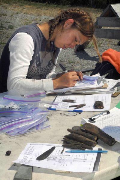 Christina Francis catalogs items extracted from the site of the ancient village of Tse-whit-zen in Port Angeles, Wash., last month.  (Associated Press / The Spokesman-Review)