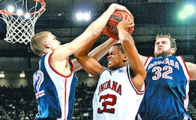 
Joey Shaw of Indiana fights for a rebound with Gonzaga's Micah Downs, left, and Sean Mallon during the first half.
 (Jed Conklin / The Spokesman-Review)