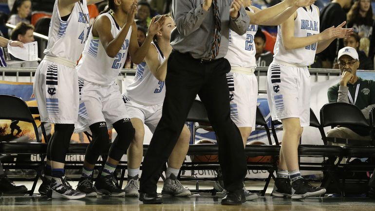 Central Valley head coach Freddie Rehkow cheers with his players on the bench late in the second half of the Washington state girls 4A high school basketball championship against Snohomish, Saturday, March 5, 2016, in Tacoma, Wash. Central Valley beat Snohomish 57-48. (AP/Ted S. Warren)