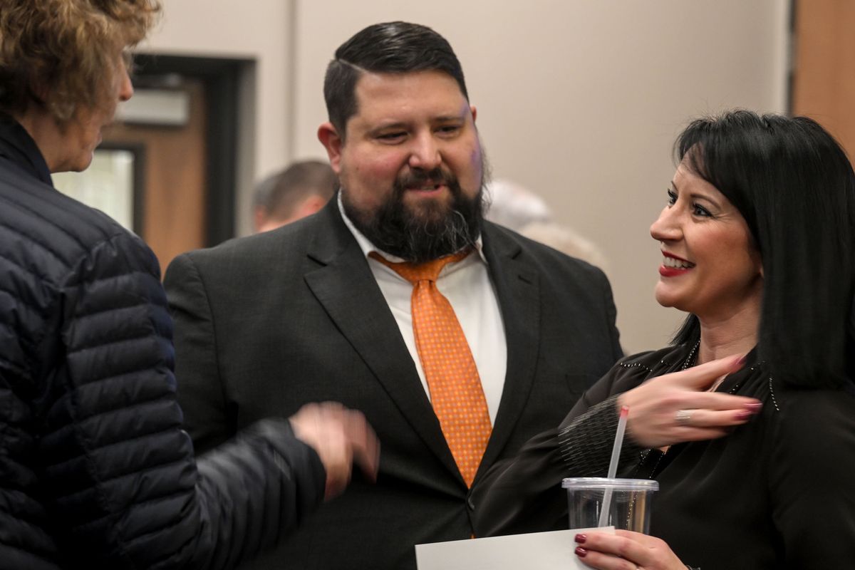 Spokane Valley’s new council members Al Merkel and Jessica Yaeger are congratulated after being sworn in as new members at Spokane Valley City Hall on Tue, Jan 2, 2023.  (Kathy Plonka/The Spokesman-Review)