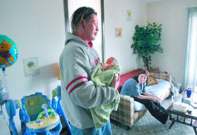 
Christopher and Dejah Bridges were living under the Maple Street Bridge before they had their son, Seven, who was 9 days old when this photo was taken on Feb. 27. They now live in the West Central neighborhood. 
 (Photos by Dan Pelle / The Spokesman-Review)