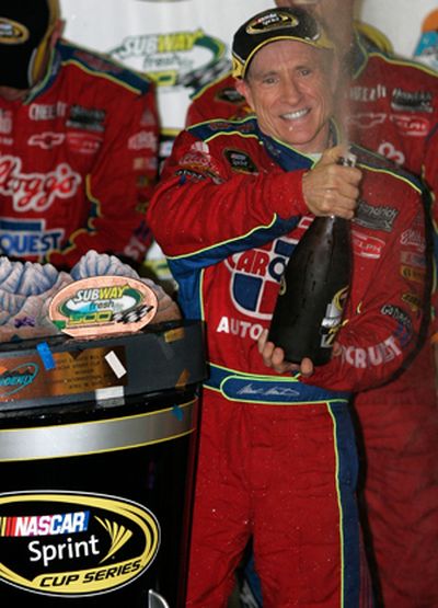 Mark Martin celebrates in Victory Lane for the first time in 97 starts. His last win was at Kansas Speedway in October 2005. (Photo Credit: Jerry Markland/Getty Images for NASCAR)  (Jerry Markland / The Spokesman-Review)