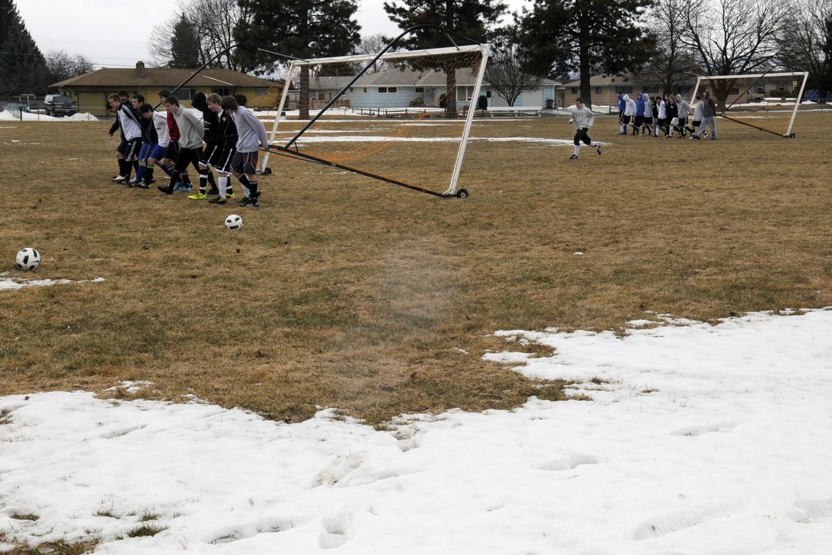 A partially snowy soccer field didn’t stop the East Valley Knights from rolling out temporary goals for the first day of practice Monday. (J. Bart Rayniak)