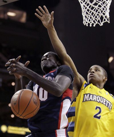 Marquette guard Vander Blue (2) and Gonzaga forward Mangisto Arop (10) battle for a rebound during the first half of an NCAA college basketball third place game in the CBE Classic Tournament Tuesday, Nov. 23, 2010 in Kansas City, Mo. (Charlie Riedel / Associated Press)