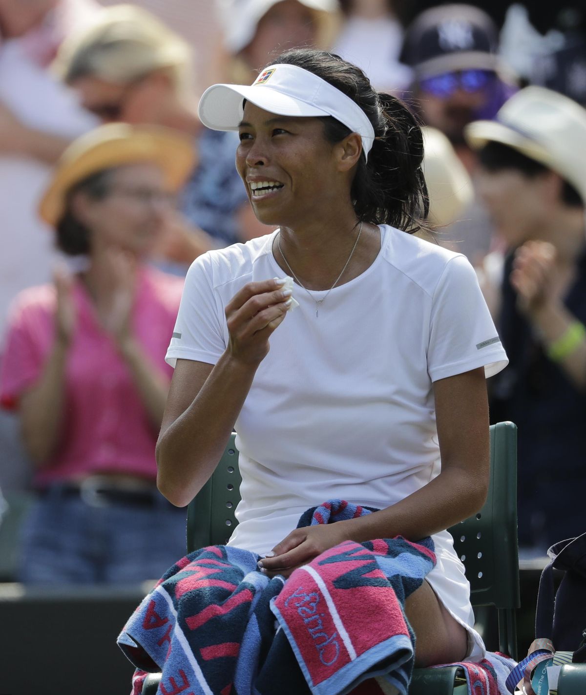 Su-Wei Hsieh of Taiwan sits in her chair after defeating Simona Halep of Romania in their women’s singles match on the sixth day at the Wimbledon Tennis Championships in London, Saturday July 7, 2018. (Ben Curtis / Associated Press)