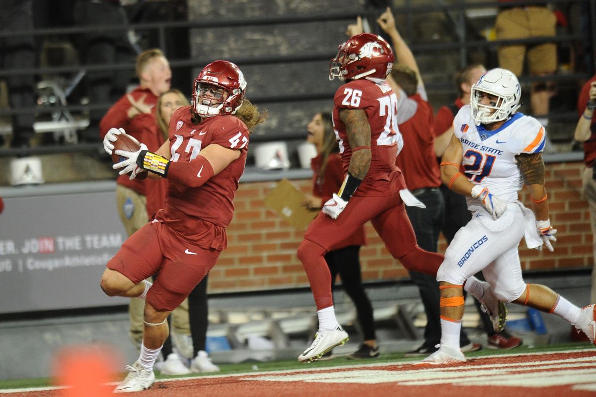 Washington State Cougars linebacker Peyton Pelluer (47) runs the ball in for a pick six during the second half of a college football game on Saturday, September 9, 2017, at Martin Stadium in Pullman, Wash. (Tyler Tjomsland / The Spokesman-Review)