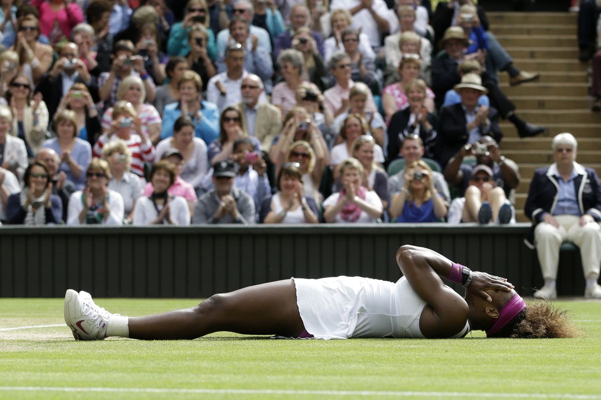 Serena Williams reacts after defeating Agnieszka Radwanska of Poland to win the women’s final match at the All England Lawn Tennis Championships. (Associated Press)