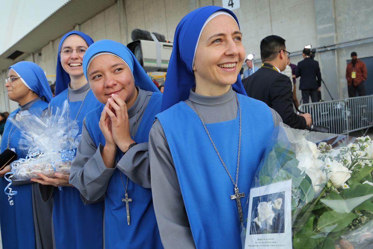 Nuns from the Monastery of the Precious Blood in Brooklyn, N.Y., stand at John F. Kennedy International Airport to bid farewell to Pope Francis as he prepares to board his plane on Saturday, Sept. 26, 2015, in New York. (John Paraskevas/Newsday via AP, Pool) (John Paraskevas / Newsday Pool)