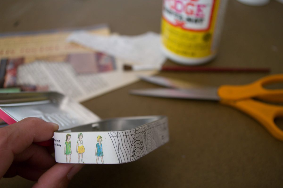 First decoupage or paint the outside of a mint tin. I enjoy using old magazine pages, maps and other paper goods with interesting images. (Katie Patterson Larson/For The Spokesman-Review)