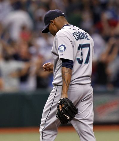 Mariners reliever Jesus Colome leaves the field after surrendering the winning home run. (Associated Press)
