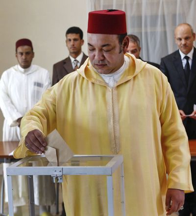 Morocco’s King Mohammed VI casts his vote in a polling station in Rabat, Morocco, on Friday. The country voted on whether to adopt a new constitution. (Associated Press)