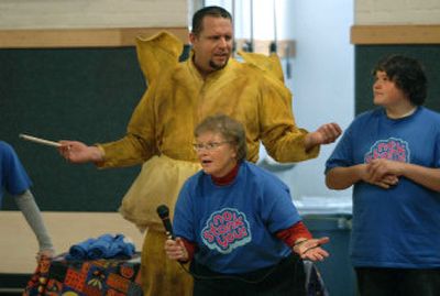 
Mary Selecky, Secretary of the Washington State Department of Health introduces  Yellow Tooth Fairy (history teacher John Adams) to students a West Valley City School during an assembly. Eighth-grader Trevor Ebel, 14, watches at right. 
 (Dan Pelle / The Spokesman-Review)
