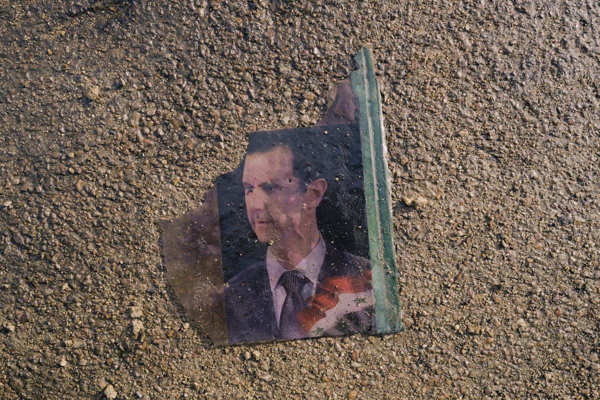 An image of former Syrian dictator Bashar al-Assad was torn and left in the ruins of the notorious Sednaya prison in December, shortly after Assad fled the country. MUST CREDIT: Lorenzo Tugnoli/For The Washington Post  (Lorenzo Tugnoli/FTWP)